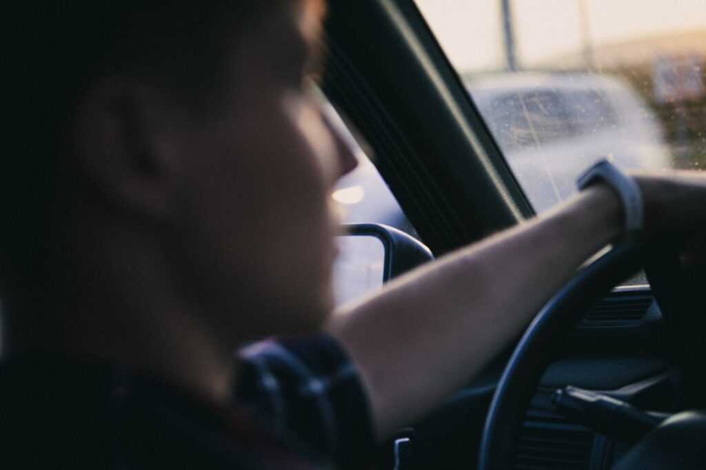 Photo by Иван Васючков: https://www.pexels.com/photo/a-person-driving-a-car-9852665/